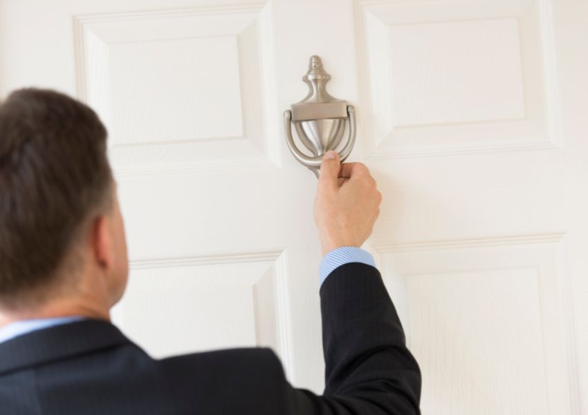 property manager knocking on a tenants door